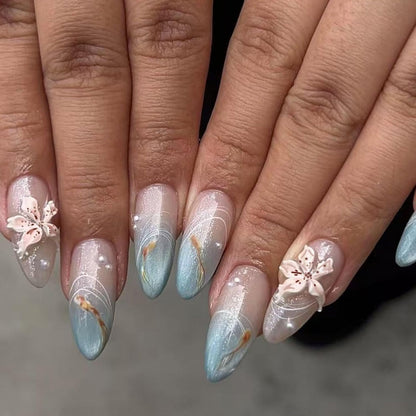 Cat Eye Press on Nails Medium Almond Fake Nails with 3D Flower White Pearl Lines Designs Glossy Nails Press Ons Blue Gradient Glue on Nails Summer Acrylic Artificial Stick on Nails for Women 24Pcs