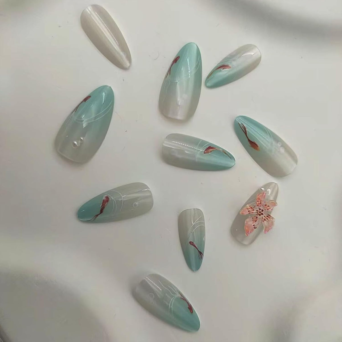 Cat Eye Press on Nails Medium Almond Fake Nails with 3D Flower White Pearl Lines Designs Glossy Nails Press Ons Blue Gradient Glue on Nails Summer Acrylic Artificial Stick on Nails for Women 24Pcs